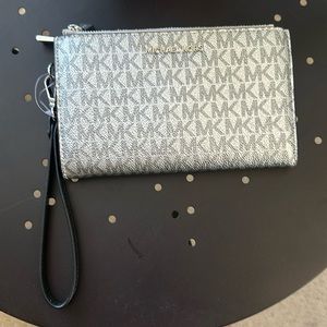 NEW. Michael Michael Kors, Adele logo, leather, smart phone wallet, Silver